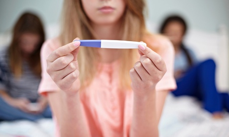 Teenage girl with a pregnancy test.