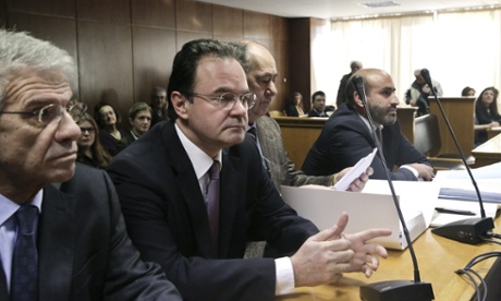 Former Greek finance minister George Papaconstantinou, second left, in court on Wednesday.