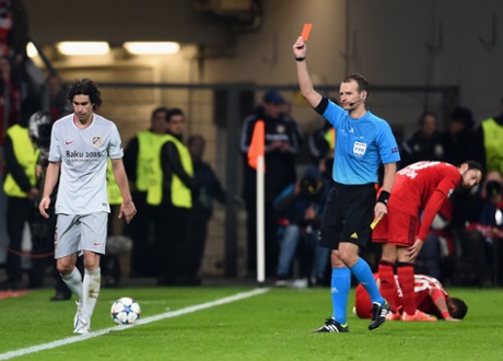 Referee Pavel Kralovec shows Tiago a red card.