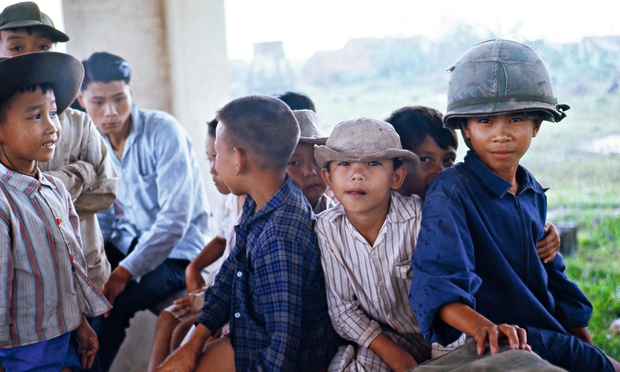 Vietnam War 1965 - Soldier Drinks Coke With Kids In Nam in 
