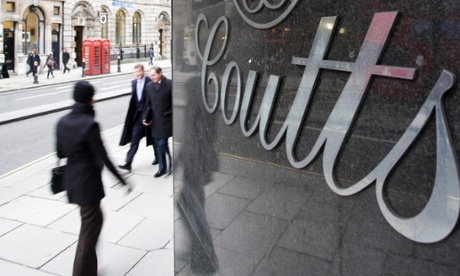 A pedestrian walks past a branch of Coutts & Co. in London.