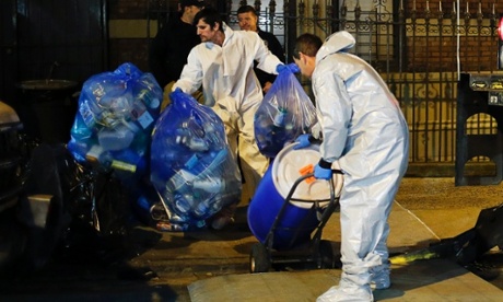 A biohazard crew clean the apartment of Dr Craig Spencer in New York City last week.