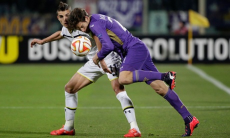 Still goalless as Fiorentina's Marcos Alonso and Erik Lamela fight for the ball.