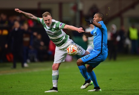 John Guidetti of Celtic and Inter's Juan battle for the ball at Stadio Giuseppe Meazza.