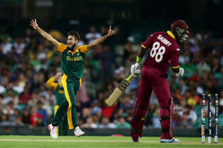 Imran Tahir celebrates taking the wicket of Darren Sammy.