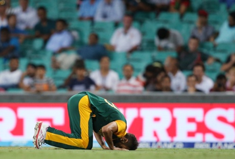 South Africa's Muhammad Imran Tahir celebrates  taking the wicket of Denesh Ramdin.
