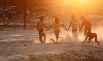 Indian children play on the banks of the river Ganges in Allahabad, India. India has the highest child mortality rate in the world. 