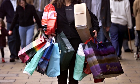 A woman carrying several shopping bags