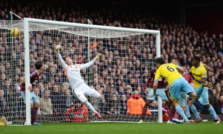Scott Dann heads home Puncheon's cross.