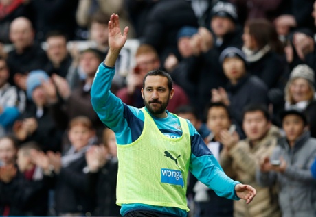 Jonas Gutierrez waves to the fans as he warms up on his return to St James' Park after fighting after cancer.