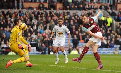 Ashley Barnes' shot hits Fabianski.