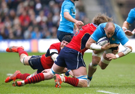 Jonny Gray gets hold of a marauding Sergio Parisse of Italy.
