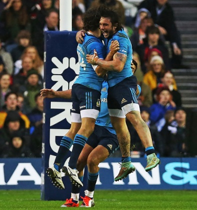 Italian players celebrate at full time.