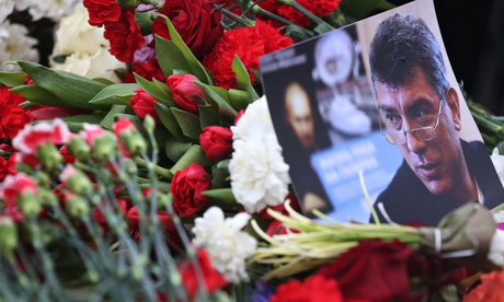 Flowers were laid at the spot where Russian politician Boris Nemtsov was shot dead on Friday.