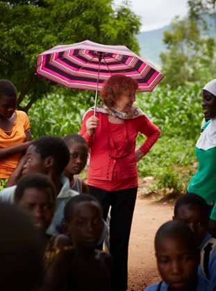 ‘We don’t send in outsiders to tell them what to do.’ Ann Cotton with Camfed pupils in Malawi – she says staff are recruited only from within Africa.