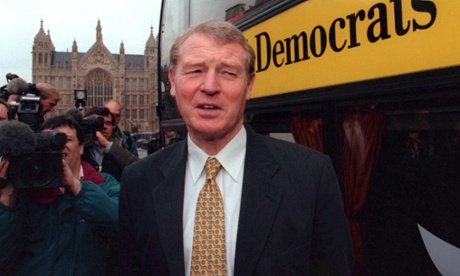 Liberal Democrats leader Paddy Ashdown speaks to reporters next to his campaign bus outside parliament in 1997.