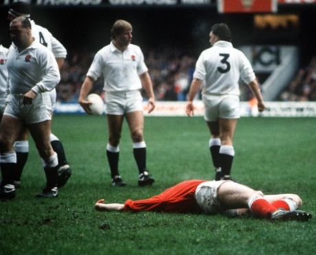 A Welsh player lies pole axed after a meeting with the England forwards.