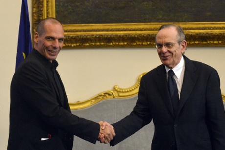 Greek Minister of Finance Yanis Varoufakis (L) shakes hands with his Italian counterpart Pier Carlo Padoan during their meeting on February 3, 2015 in Rome.