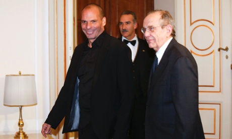 Greek Finance Minister Yanis Varoufakis (L) walks next his Italian counterpart Pier Carlo Padoan during a meeting in Rome, February 3, 2015.