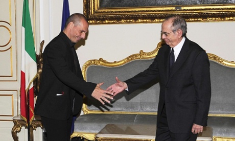 Italian Finance Minister Pier Carlo Padoan (right) greets new Greek Finance Minister Yanis Varoufakis (left).