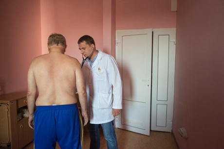 Andrei Semivolos with a patient at the National Cancer Institute in Kiev, Ukraine.