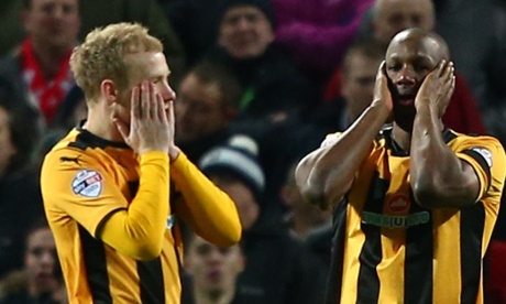 Cambridge United's Tom Elliott, with Robbie Simpson looking on disbelief too, can't believe his shot didn't go in !