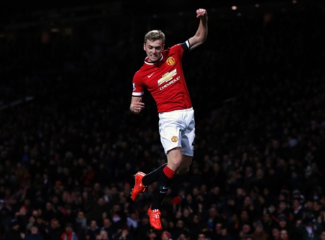 Manchester United's James Wilson leaps for joy after scoring their third goal minutes after substituting Robin van Persie