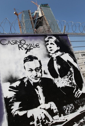A graffiti depicting German Chancellor Angela Merkel and European Central Bank (ECB) president Mario Draghi is seen on the fence around the site of ECB's new building under construction in Frankfurt am Main on June 6, 2013, 2013.