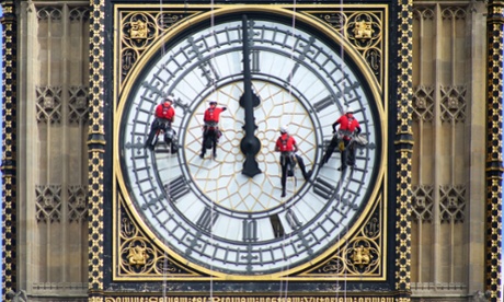 Abseilers cleaning Big Ben.