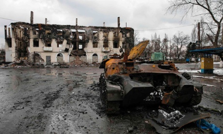An armoured vehicle and a building, damaged during battles between the armed forces of the separatist self-proclaimed Donetsk People's Republic and the Ukrainian armed forces, are seen in Vuhlehirsk, Donetsk.