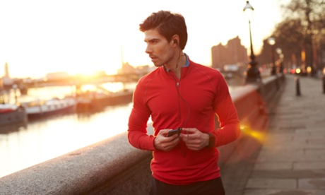 Man runs by the river in London at dawn