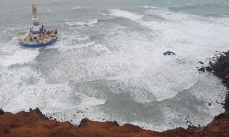 Shell's drilling rig Kulluk aground off a small Alaskan island in the Arctic.