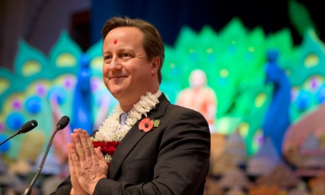 Namaste … David Cameron takes part in a ceremony at a Hindu temple in London during Diwali.