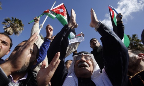 Jordanians chant slogans to show their support for action against Isis.