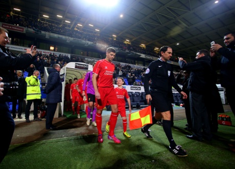 Steven Gerrard leads out his team as captain in his 700th appearance for Liverpool.