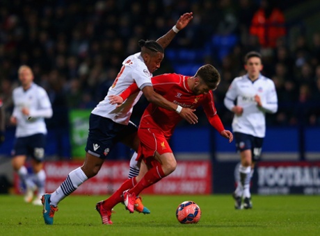 Neil Danns challenges Adam Lallana.