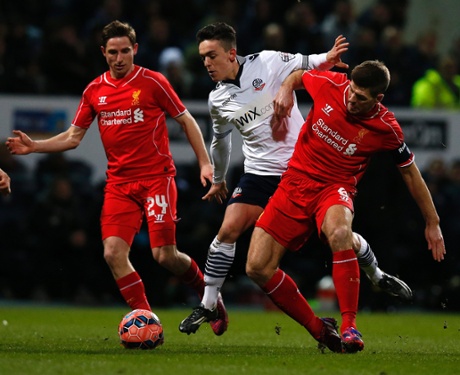 Zach Clough is challenged by Steven Gerrard.