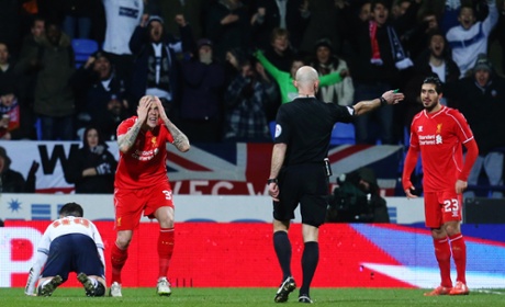 Martin Skrtel looks dejected after conceding the penalty.
