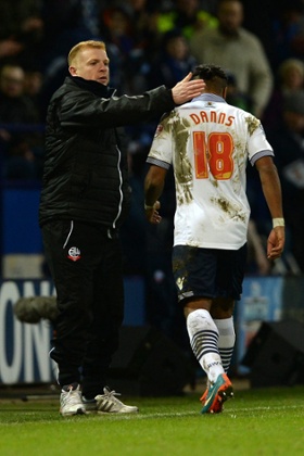 Neil Danns is consoled by manager Neil Lennon after being sent off.