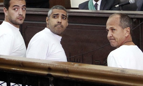 Baher Mohamed, left, Mohamed Fahmy, centre, Peter Greste, right, in court