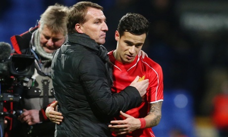Liverpool manager Brandan Rodgers celebrates after the match with Philippe Coutinho.