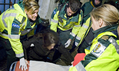 Ambulance staff treating revellers during New Year's Eve in London