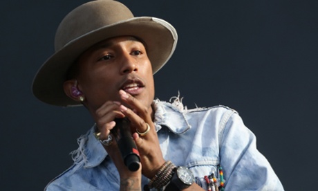 Pharrell Williams performing onstage in London in July 2014