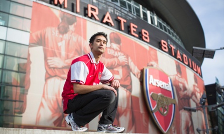 Gay Gooner Dave Raval proudly poses outside Arsenal's Emirates Stadium