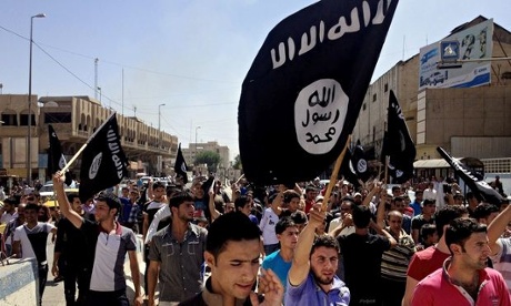 Islamic State supporters carry the group's flag in Iraq