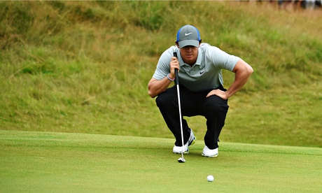 Rory McIlroy of Northern Ireland lines up a putt during the 2014 Open. Photograph: Ian Walton/R&A