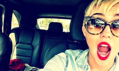 Miley Cyrus takes a selfie in her car