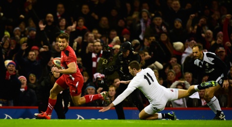 Rhys Webb gets past Jonny May to score the first try .