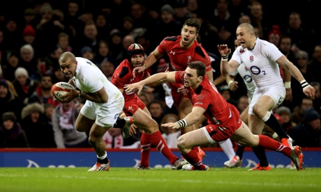 Jonathan Joseph goes past the challenge from George North to score his team's second try.