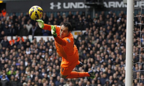 A diving David Ospina is more than equal to Ryan Mason's effort.